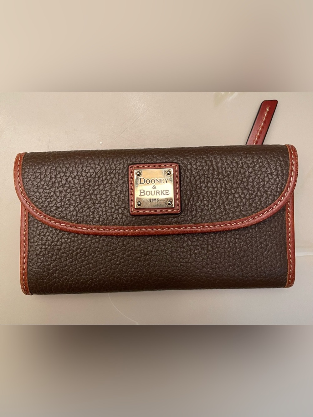 Dooney & Bourke Dark Brown Pebbled Leather Wallet with Brown Trim and Red Lining